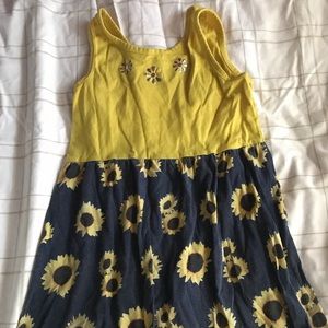 A yellow sunflower blue dress